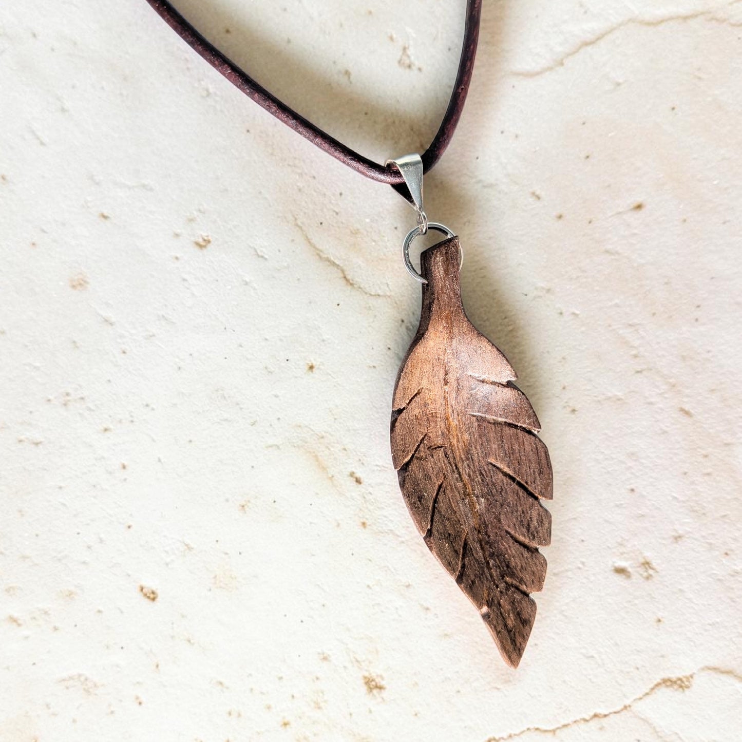 Hand-carved walnut wood pendant