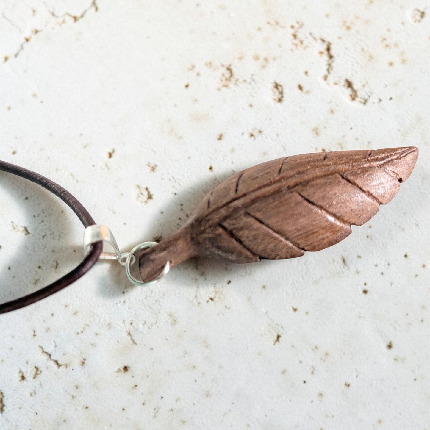 Hand-carved walnut wood pendant