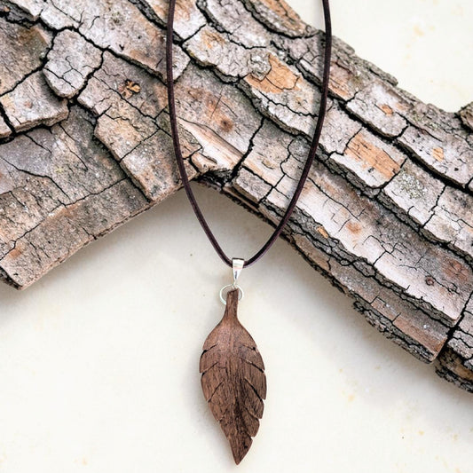 Hand-carved walnut wood pendant