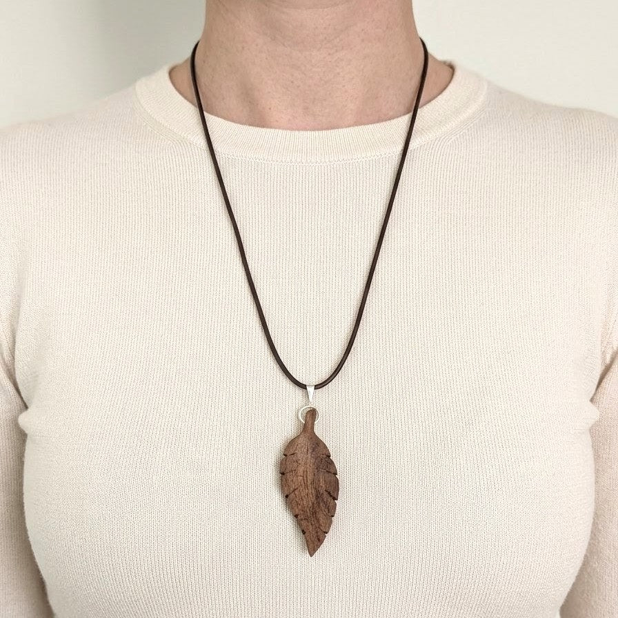 Hand-carved walnut wood pendant
