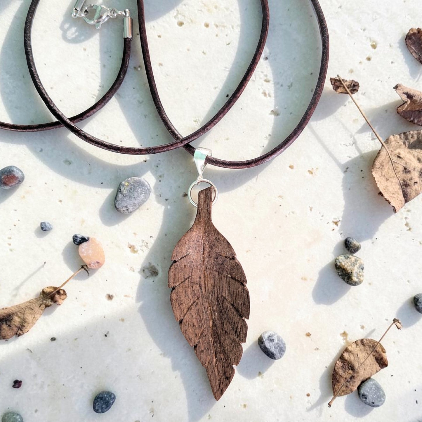 Hand-carved walnut wood pendant